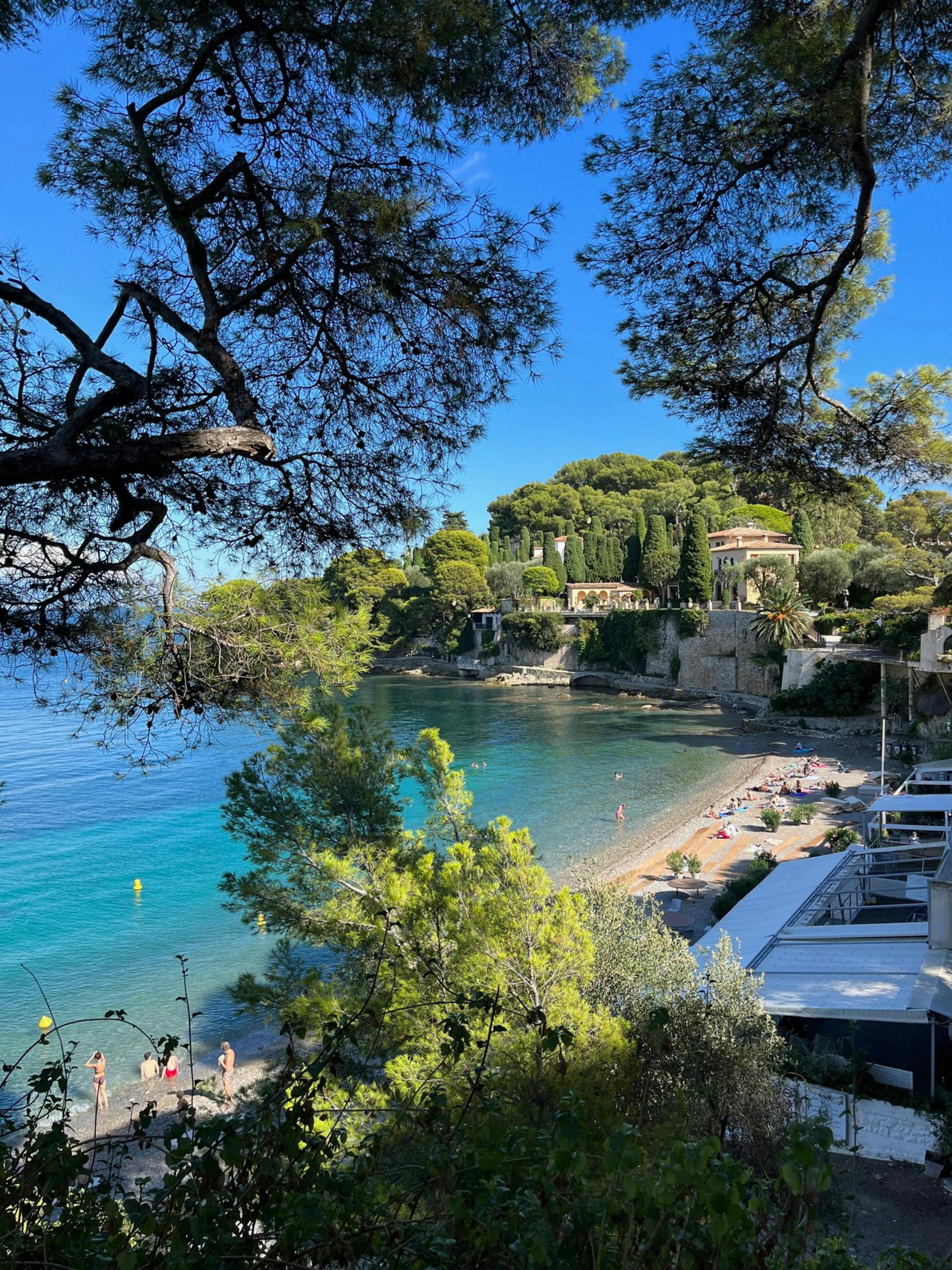 Beautiful coastal scenery in Nice, France, showcasing turquoise waters and lush greenery.